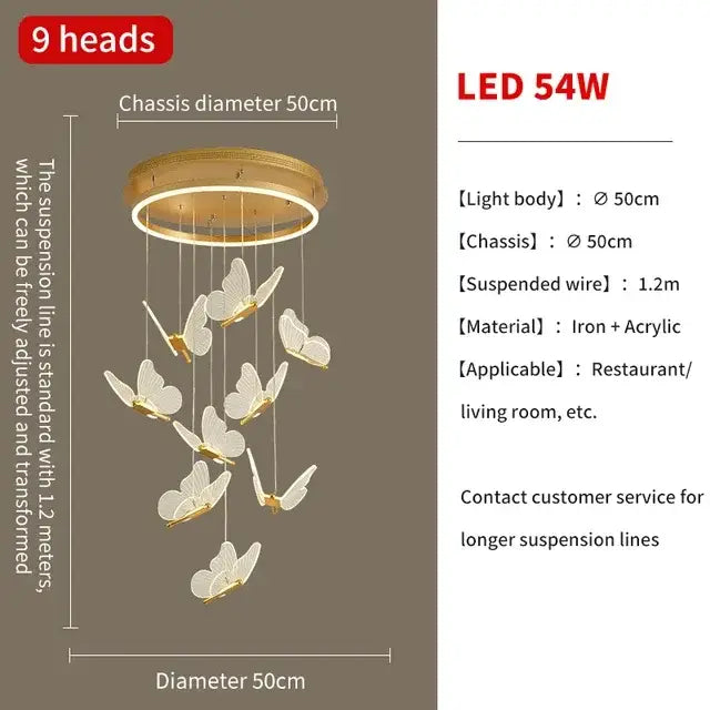 Gold-toned decorbites butterfly chandelier with nine white butterfly ornaments on circular iron and acrylic frame