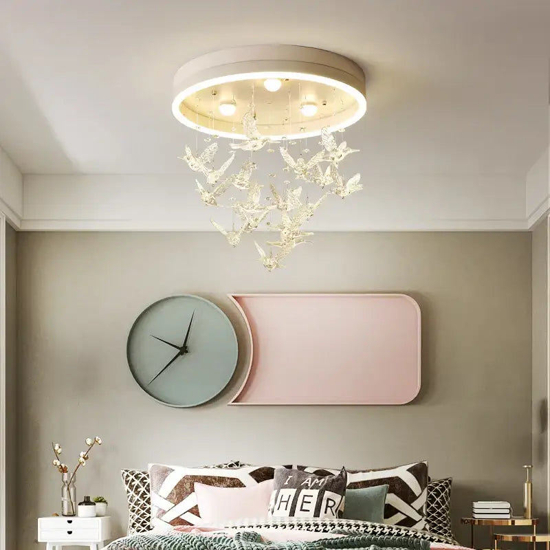 Gold butterfly crystal led ceiling lamp with white frame and clear bird-shaped pendants for kids bedroom decorbites crystal led