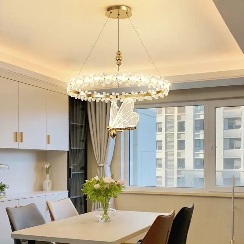 Gold butterfly crystal led chandelier with circular frame and clear crystal droplets for elegant decorbites crystal led decor
