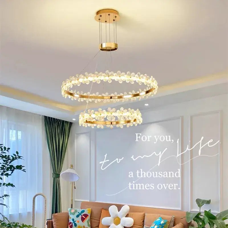 Gold-toned double-ring crystal led chandelier with clear flower-like embellishments for living room decorbites crystal led