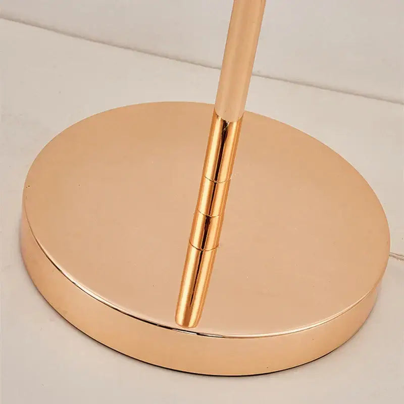 Rose gold metallic butterfly led floor lamp base with a sleek circular design and slender stem for living room decorbites butterfly led
