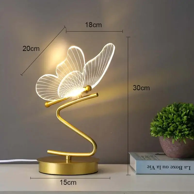 Gold butterfly led table lamp with translucent wings and curved base ideal for bedroom decor and decorbites butterfly led use