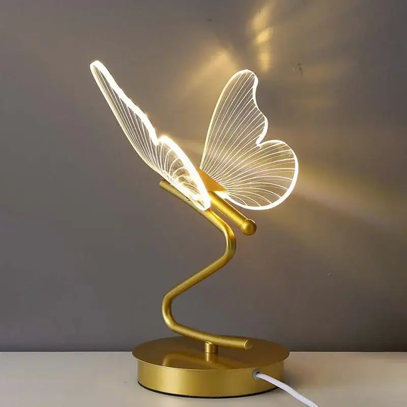 Gold butterfly led table lamp with illuminated translucent butterfly wings and sleek curved base for bedroom decorbites butterfly led