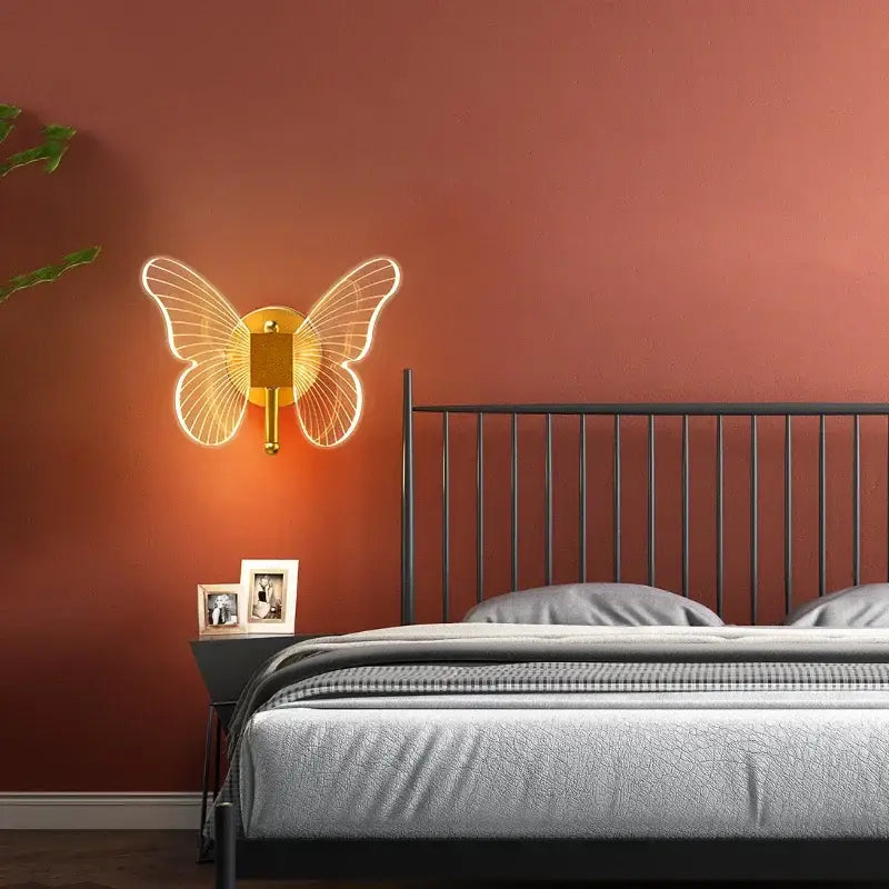 Gold butterfly wall lamp with glowing neon translucent wings and sleek metallic base for bedroom decorbites butterfly wall decor