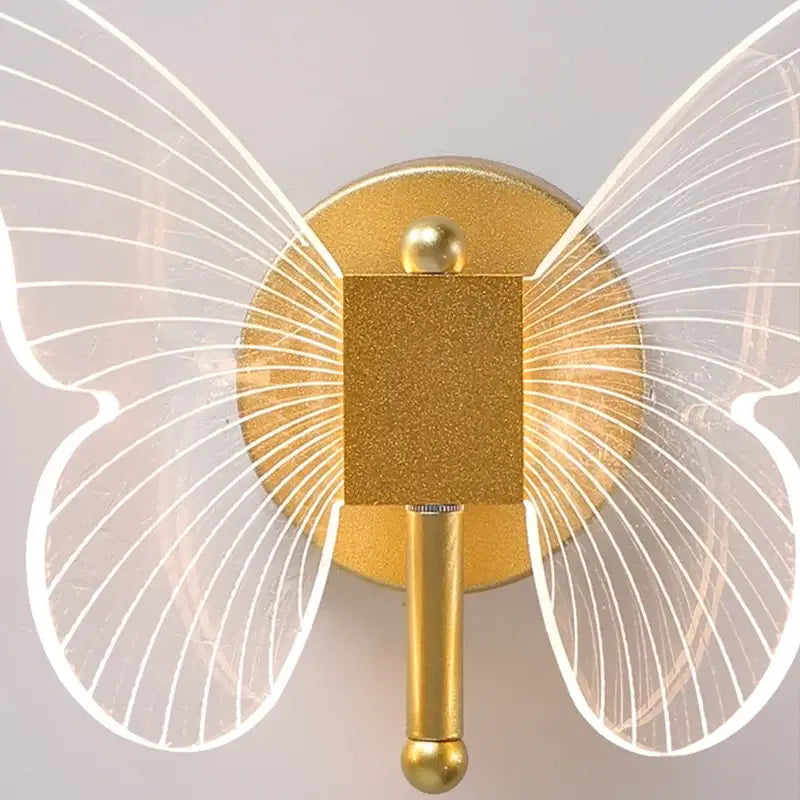 Gold butterfly wall lamp with translucent wings and glittery metallic finish for bedroom decorbites butterfly wall sconce
