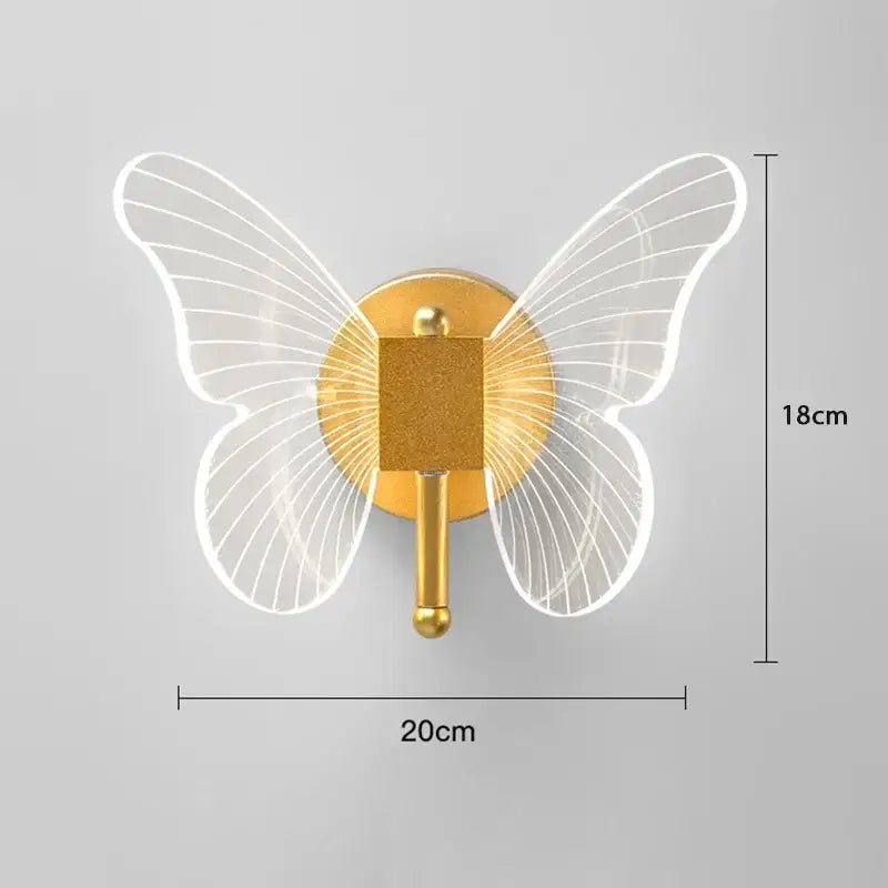 Gold-toned butterfly wall lamp with translucent illuminated wings and central square peg for decorbites butterfly wall use