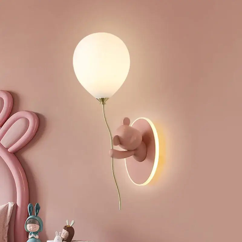 Pastel pink decorbites cartoon bear wall lamp holding a frosted white balloon with a slender gold stem for bedroom decor