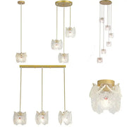 Gold carved glass pearl chandelier with gold finish and lace-like carved glass shades for elegant dining room decorbites decor