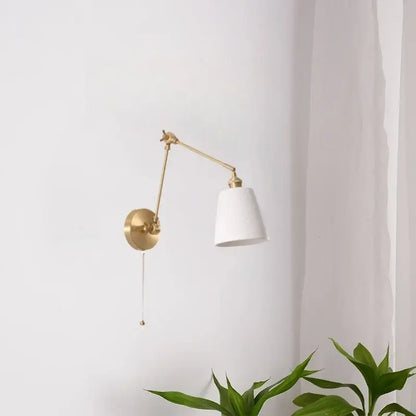 A sleek gold ceramic led wall lamp with brass adjustable arm and white ceramic shade for living room decorbites ceramic led