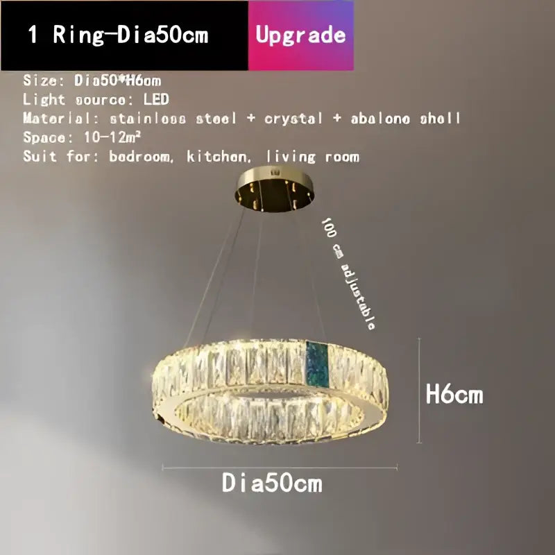 A modern gold circular decorbites crystal led chandelier with stainless steel frame and abalone shell accents for dining room