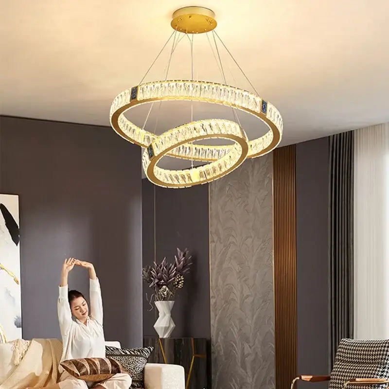 Gold-toned double-ring decorbites crystal led chandelier with clear crystal accents for elegant dining room lighting