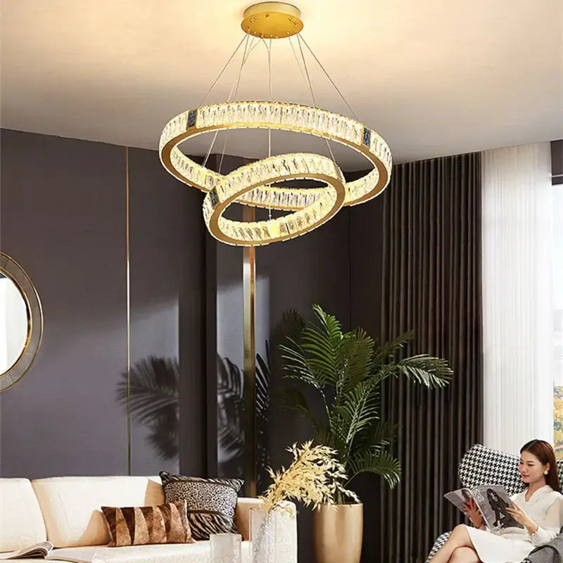 Gold circular decorbites crystal led chandelier with interlocking rings and clear crystals for dining room lighting
