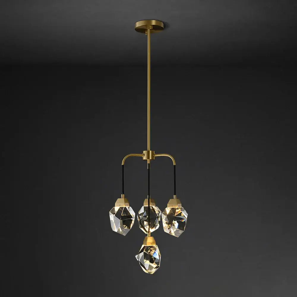 A modern gold circular stone lustre chandelier with four faceted diamond crystal stone pendants for dining room