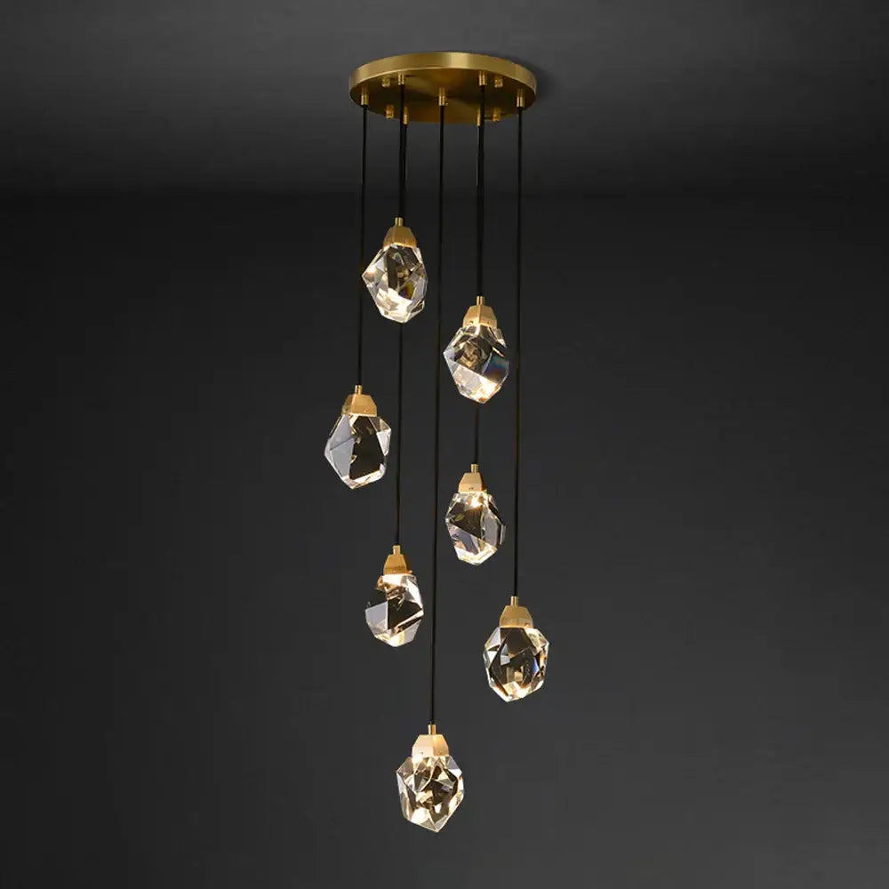 A modern gold circular stone lustre chandelier with seven faceted clear diamond crystal stone pendant lights