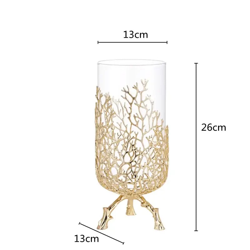 A tall transparent glass coral crystal tree vase with gold-toned coral lattice and three branching feet for decor
