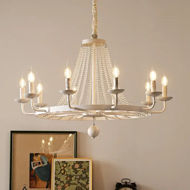 White country candle crystal chandelier with gold accents and candle-style bulbs for dining room decorbites country candle