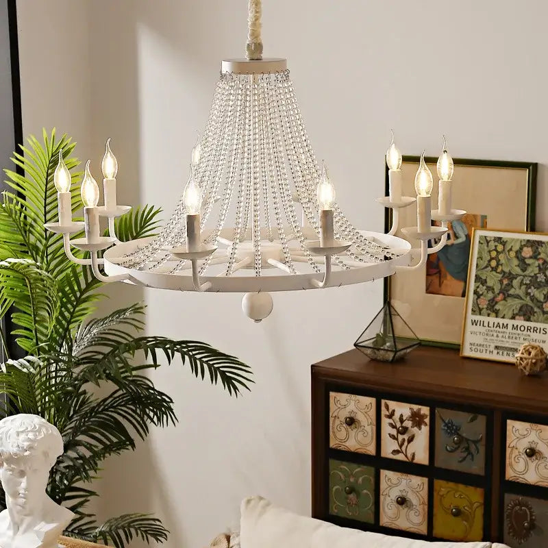 White country candle crystal chandelier with cascading beads and candle-style lights for dining room decorbites