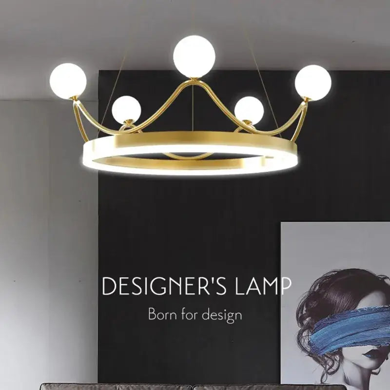 Gold-toned crown led chandelier with five white globe bulbs for kids room decor by decorbites crown led