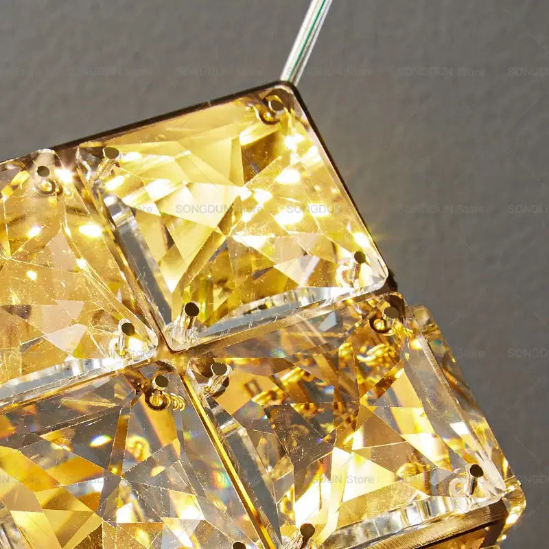 Gold crystal bedside chandelier wall light featuring faceted square-cut stones in a geometric pattern for bedroom decorbites crystal bedside