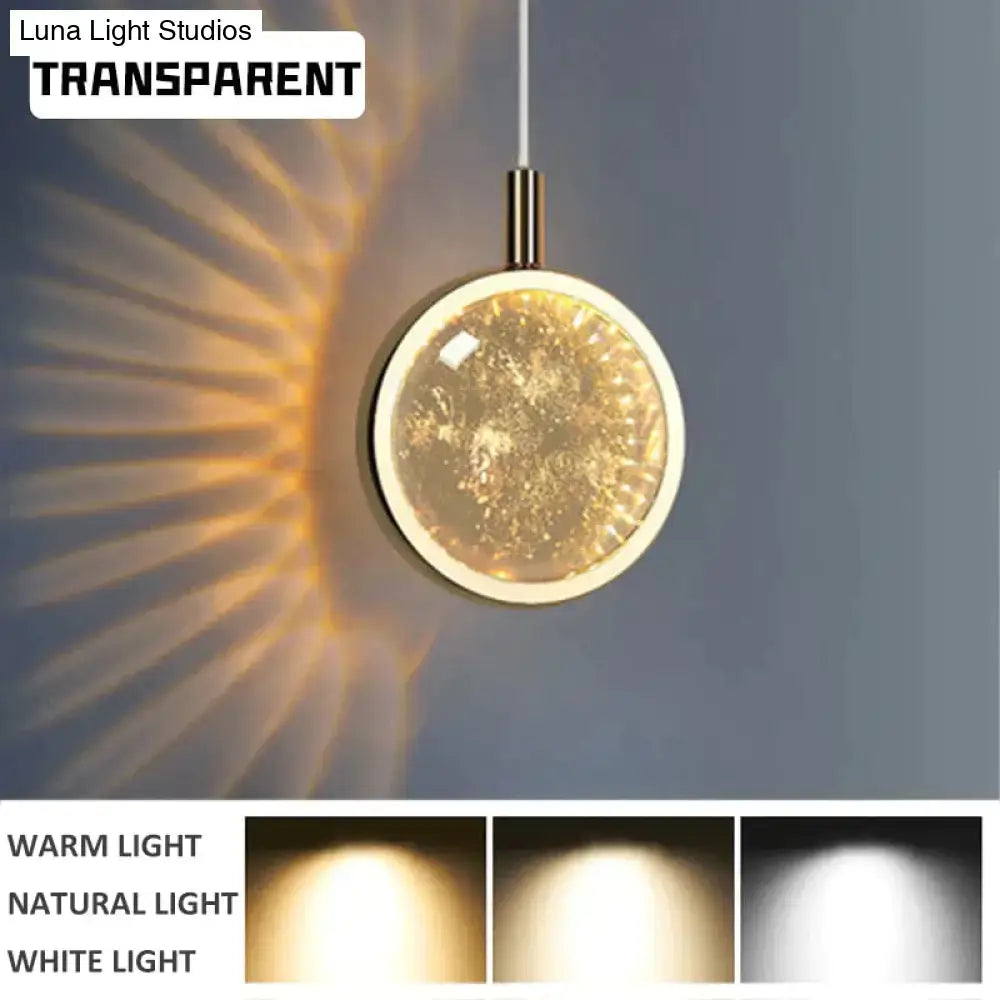 DecorBites Clara transparent circular LED crystal glass pendant lights with gold-toned frame and warm glowing interior