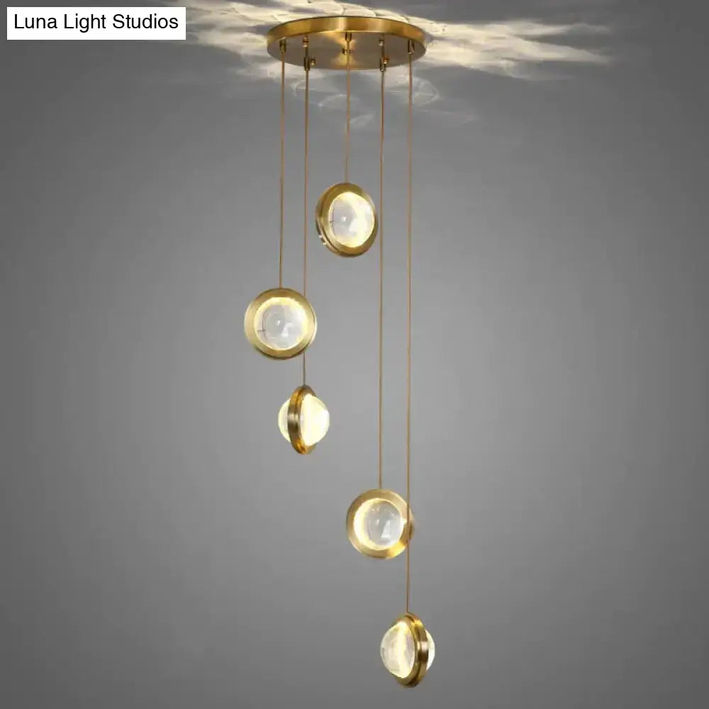 Brass-finished pendant lights with five translucent led crystal glass globes by DecorBites for indoor lighting