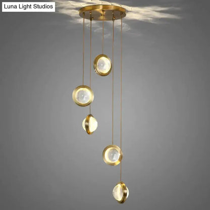 Brass-finished pendant lights with five translucent led crystal glass globes by DecorBites for indoor lighting