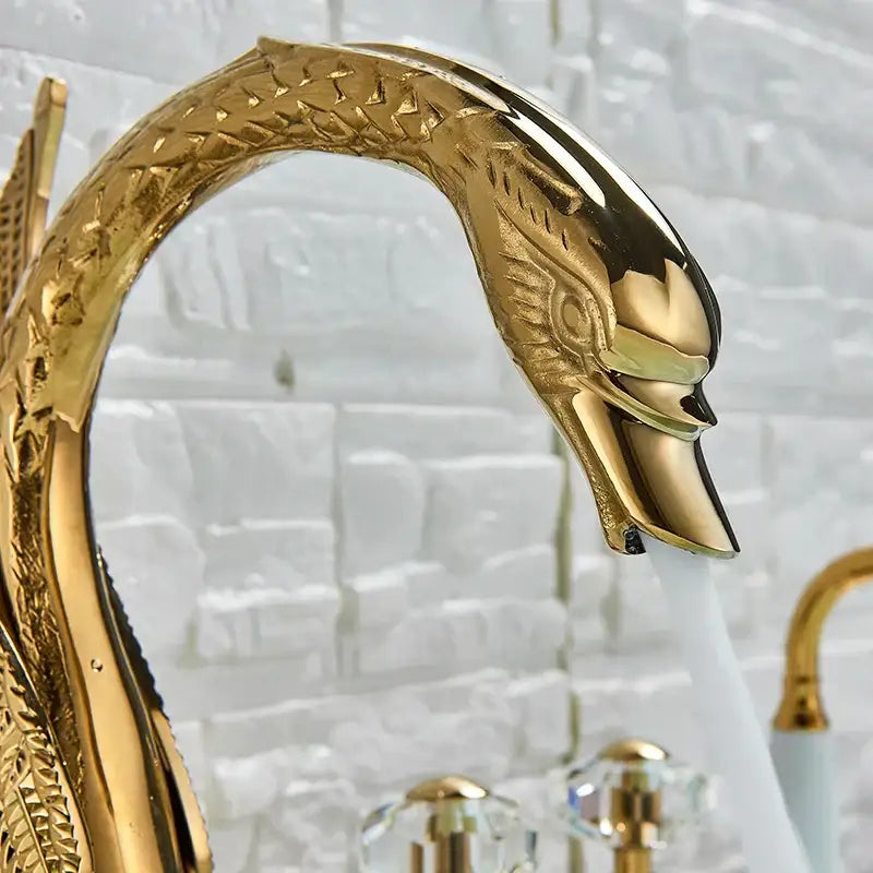 Golden crystal knob swan faucet with polished metallic finish and intricate engravings for bathroom tub mixer decorbites crystal knob