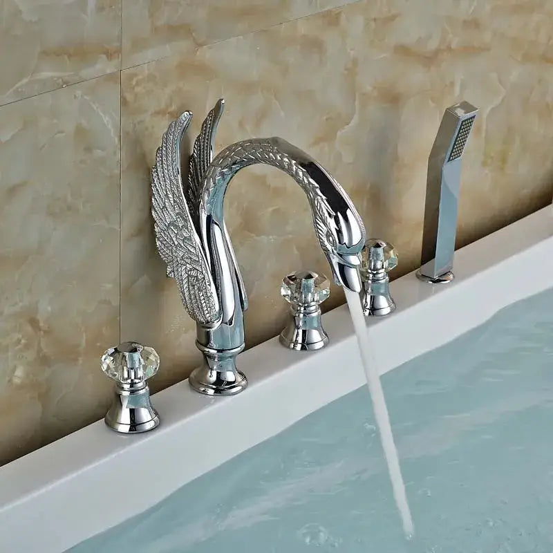 Chrome-finished crystal knob swan bathtub faucet with ornate winged design and decorbites knob swan faucet handshower