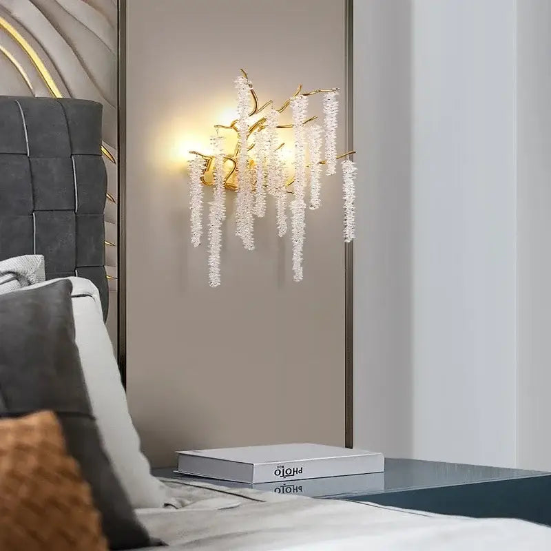Gold-toned decorbites crystal led wall sconce with cascading white crystal strands for elegant dining room lighting