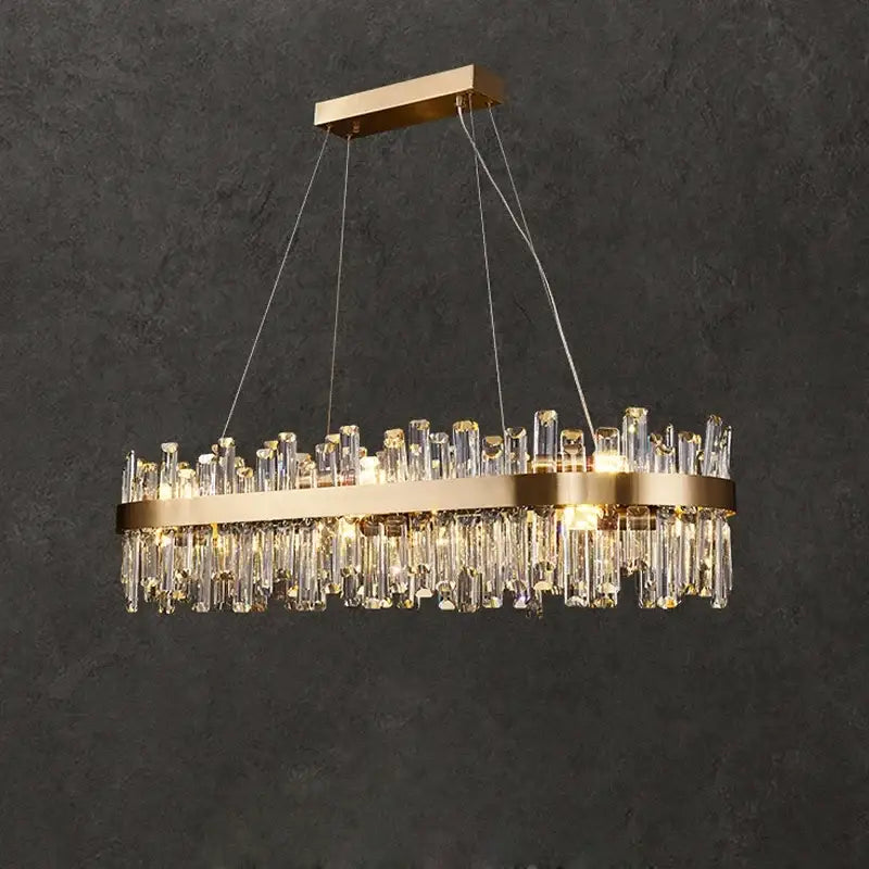 Gold-toned crystal led oval chandelier with cascading clear crystal rods and sleek metallic frame for dining room decorbites crystal led