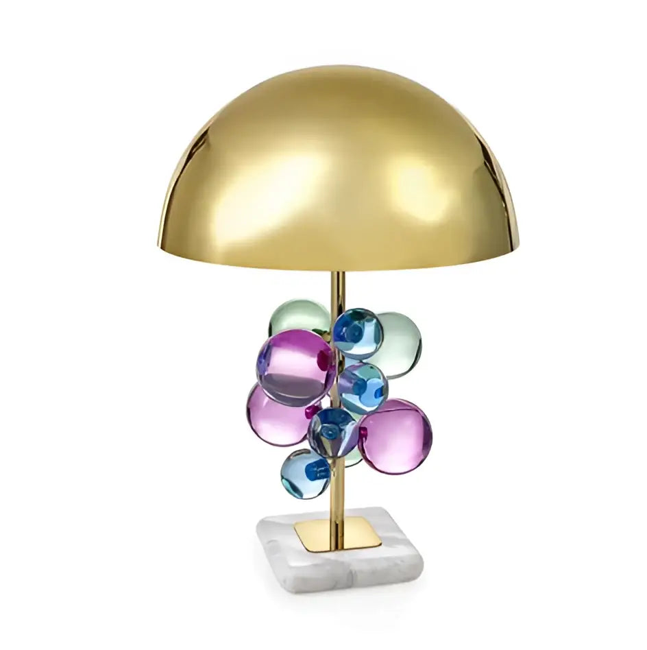 A gold crystal marble bubble table lamp with a polished gold dome shade and colorful glass orbs on a white marble base