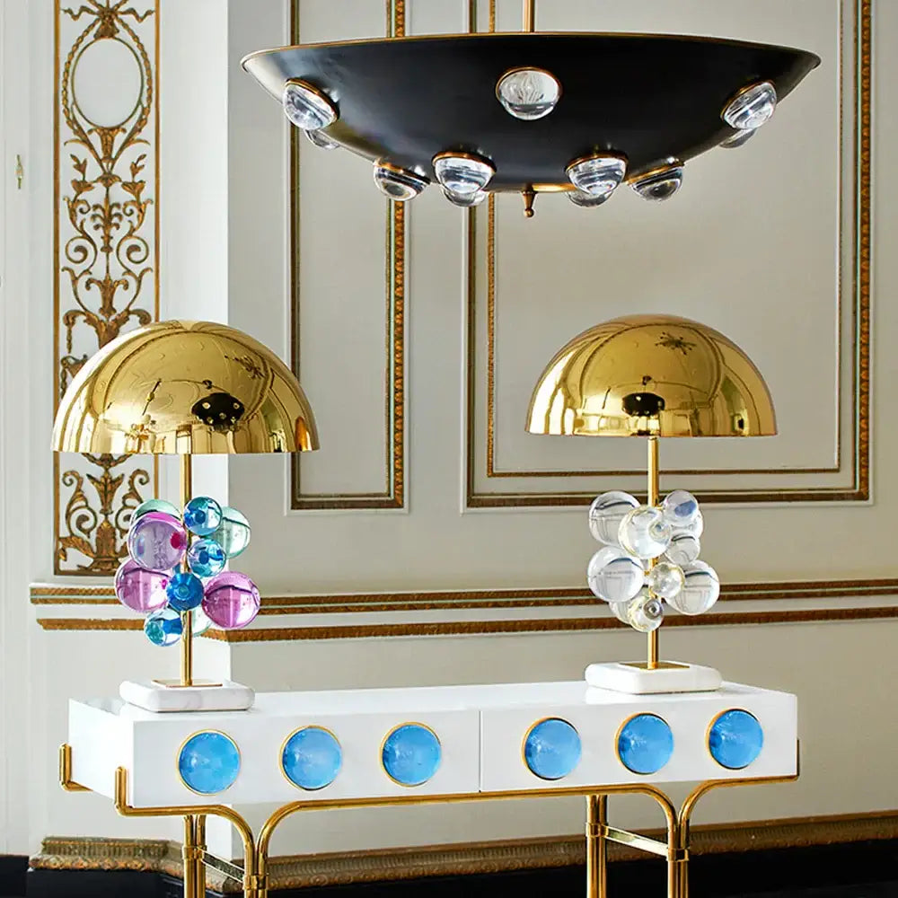 Two gold crystal marble bubble table lamps with vibrant clustered glass orbs on a white console for bedroom decor