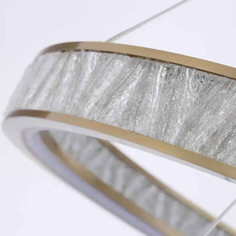 Modern gold crystal oval pendant chandelier with textured clear glass panels and brushed gold metal frame for dining room decorbites crystal oval