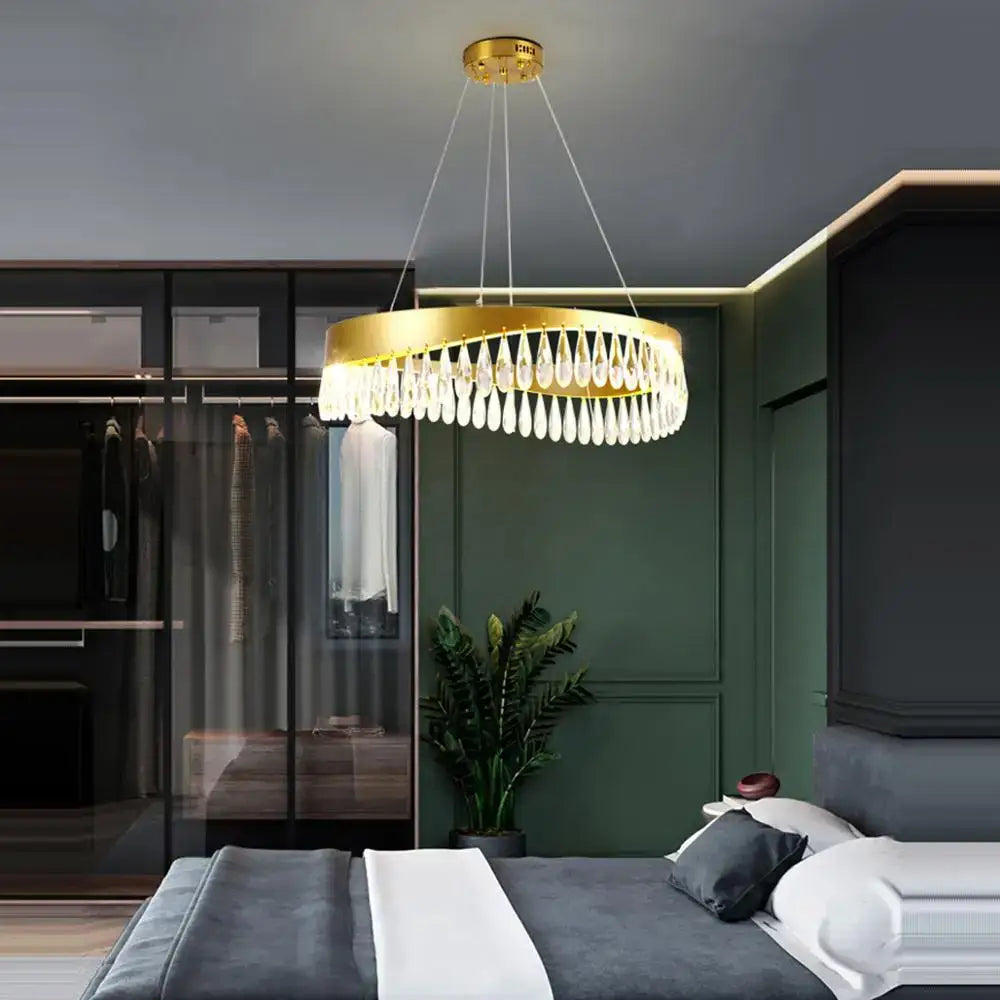 Gold crystal stainless steel circular chandelier with gold-toned teardrop crystal droplets for elegant foyer decorbites crystal stainless lighting