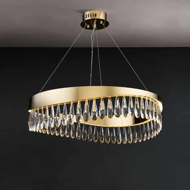 Gold-toned circular chandelier with dangling crystal teardrop pendants made of decorbites crystal stainless steel