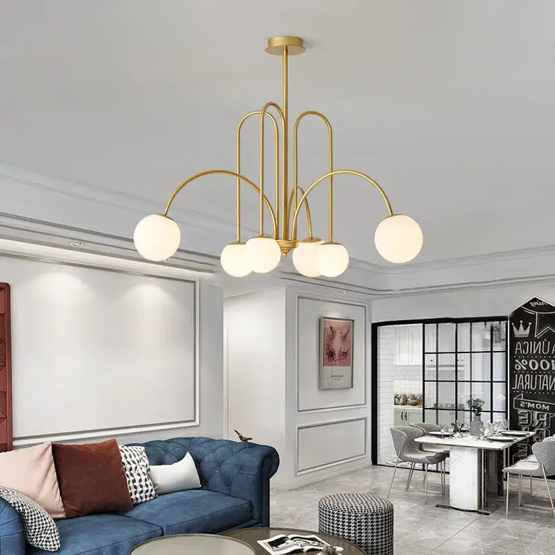Gold curved arm ball pendant chandelier with five frosted glass shades for dining room decorbites glass ball pendant