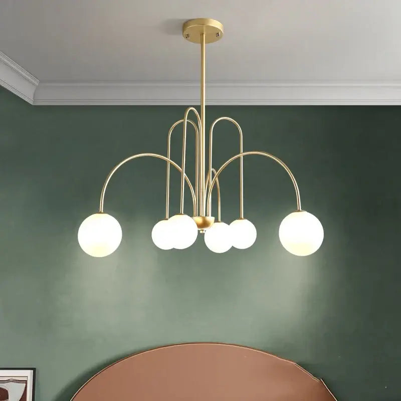 Gold curved arm glass ball pendant chandelier with five frosted glass globes for dining room decorbites glass ball design