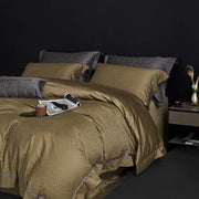 Gold satin bedding set with subtle leopard print and dark gray pillows made from decorbites 100s egyptian cotton