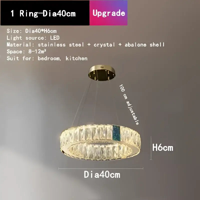 A modern gold decorbites crystal round ceiling chandelier with stainless steel frame and abalone shell accent for dining room