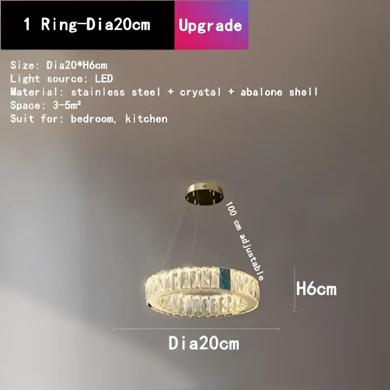 A modern gold decorbites crystal round ceiling chandelier with stainless steel frame and abalone shell accent for dining room