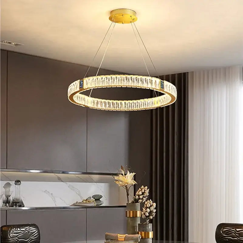 Gold decorbites crystal round ceiling chandelier with gold-toned ring and clear faceted crystals for dining room use