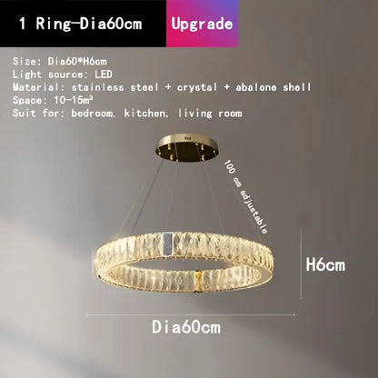 Gold-toned decorbites crystal round ceiling chandelier with modern design featuring crystal and abalone shell accents