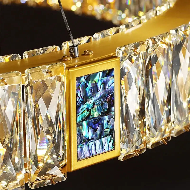 Gold decorbites crystal round ceiling chandelier with faceted prisms and iridescent abalone inlay for dining room