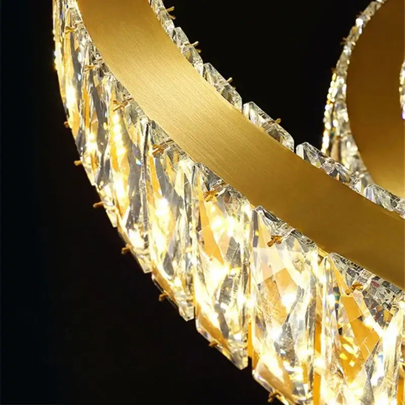 Gold decorbites crystal round ceiling chandelier with sleek gold metal frame and cascading faceted crystal droplets