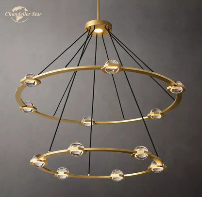 Gold-toned round crystal chandelier with double rings clear crystal spheres and black cords for dining room lighting