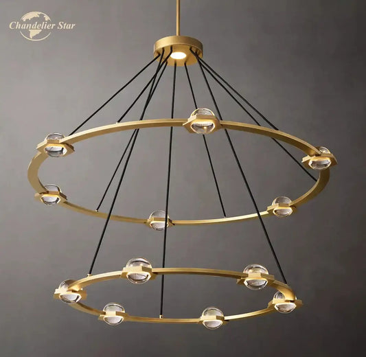 Gold-toned round crystal chandelier with double rings clear crystal spheres and black cords for dining room lighting