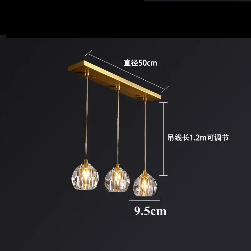 Gold-toned copper led pendant light with three diamond crystal globe shades for elegant dining room lighting