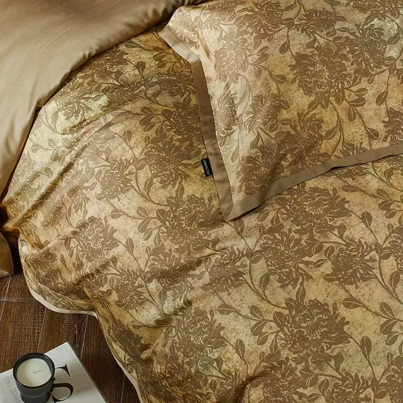 Beige satin cotton bedding set with intricate gold floral embroidery featuring duvet cover and matching pillowcase by decorbites