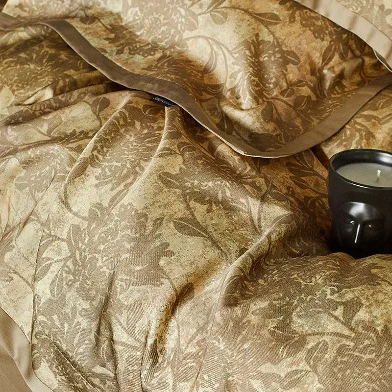 Luxurious gold floral satin cotton bedding set featuring an intricate pattern with matching duvet cover and pillowcase