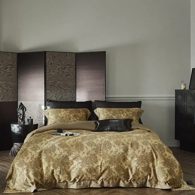 Gold floral satin cotton bedding set with matching pillows and a black accent pillow for decorbites cotton bedding